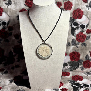 Vintage necklace with ivory lace flower in round glass pendant